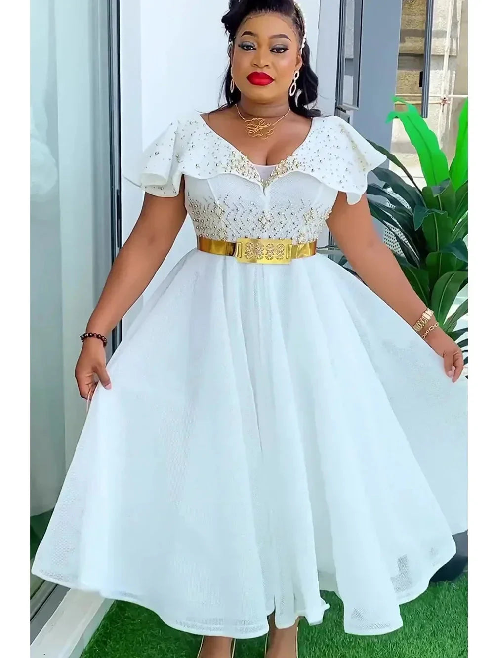 Elegant plus size Ankara African wedding gown with vibrant Dashiki design, featuring traditional patterns and a flowing silhouette.
