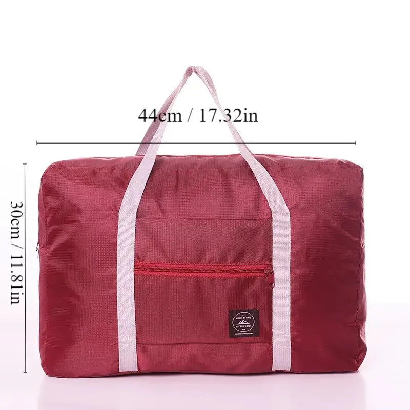 Red, navy, and green multifunctional folding travel bag with single shoulder strap, waterproof fabric, large capacity luggage storage.