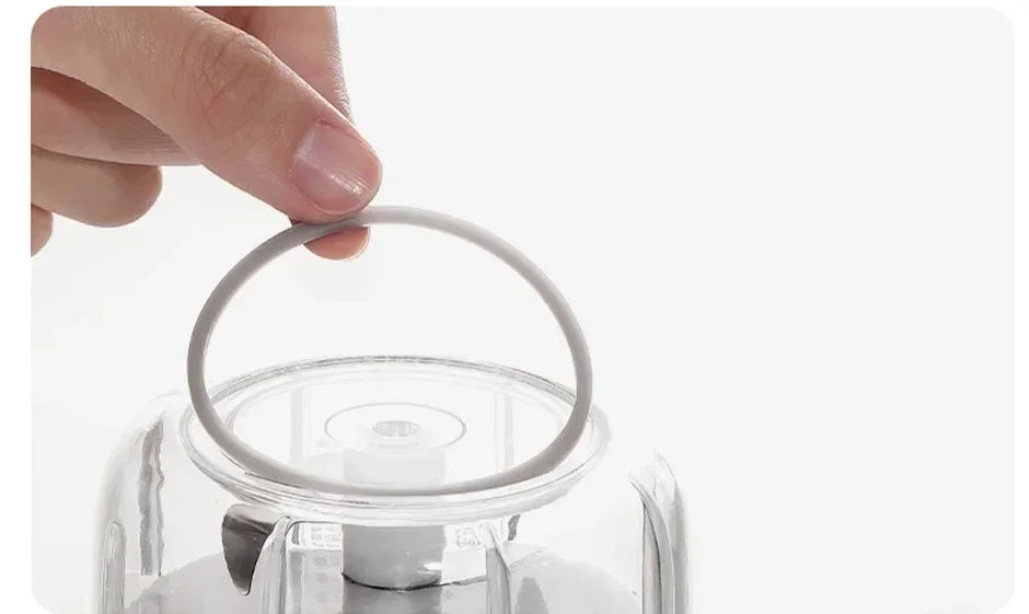 Showlu Smart General mini electric garlic grinder with stainless steel body and clear lid, ready for kitchen use.