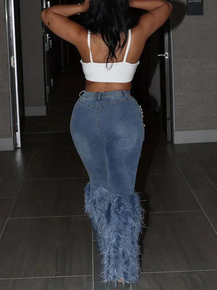 SHOWLU Women's Y2K high waist feather tassel denim jeans with vintage style and unique fringe details on a model.