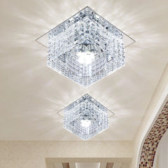 Two modern square crystal ceiling lights with stainless steel bases mounted on a white ceiling.