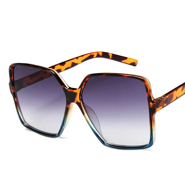 Oversize women's sunglasses with gradient plastic lenses, UV400 protection, stylish design, and brand logo from Showlu Fashion.