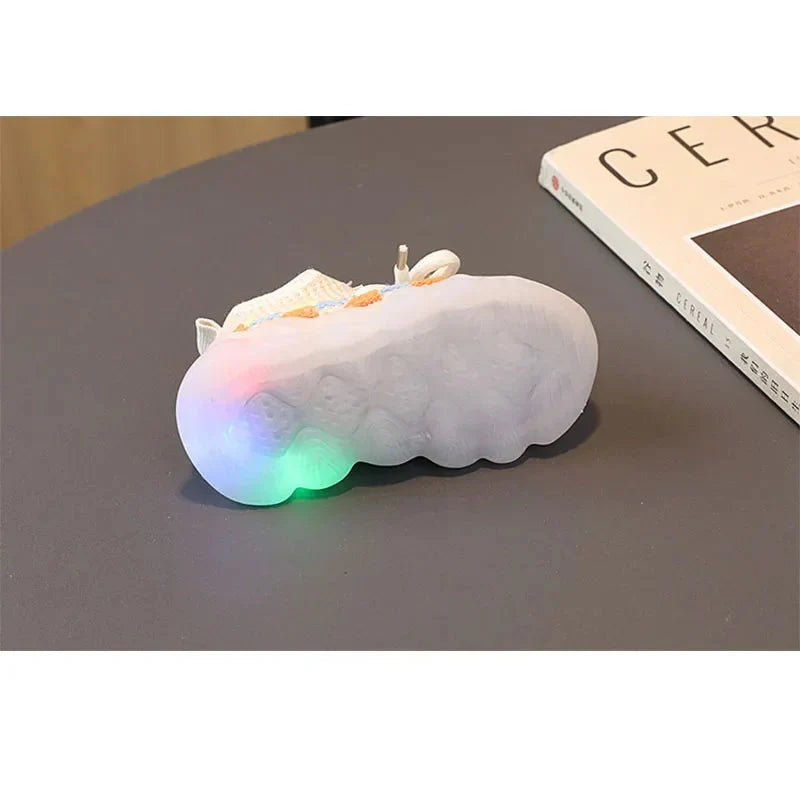 Unisex luminous LED sneakers for kids by Showlu Fashion, featuring PU leather material and glowing light accents.