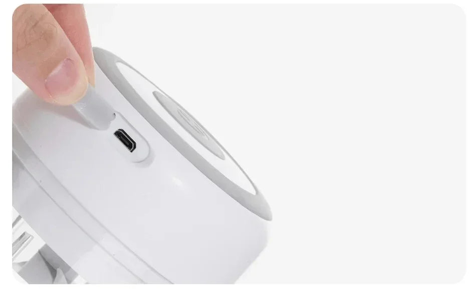 Showlu Smart General mini electric garlic grinder with stainless steel blade and compact design for easy garlic crushing.