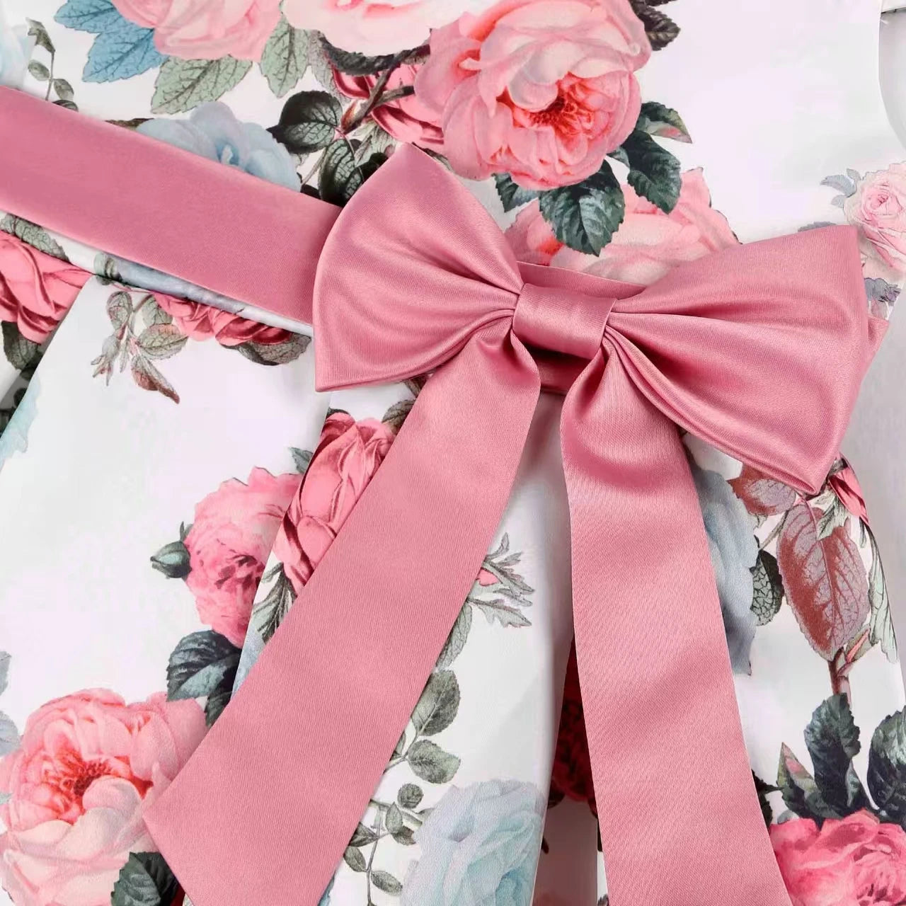 Girls' rose print dress by Showlu Fashion featuring a bow, perfect for holidays, parties, and performances.