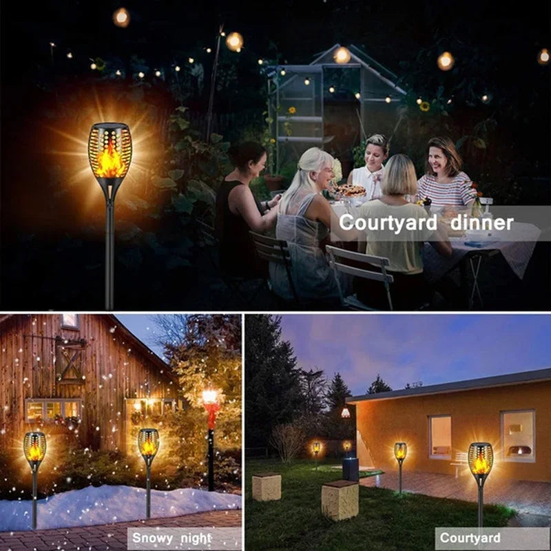 Solar Dancing Flame LED Garden Lantern by Showlu Smart General glowing with flickering flame effect in a garden setting