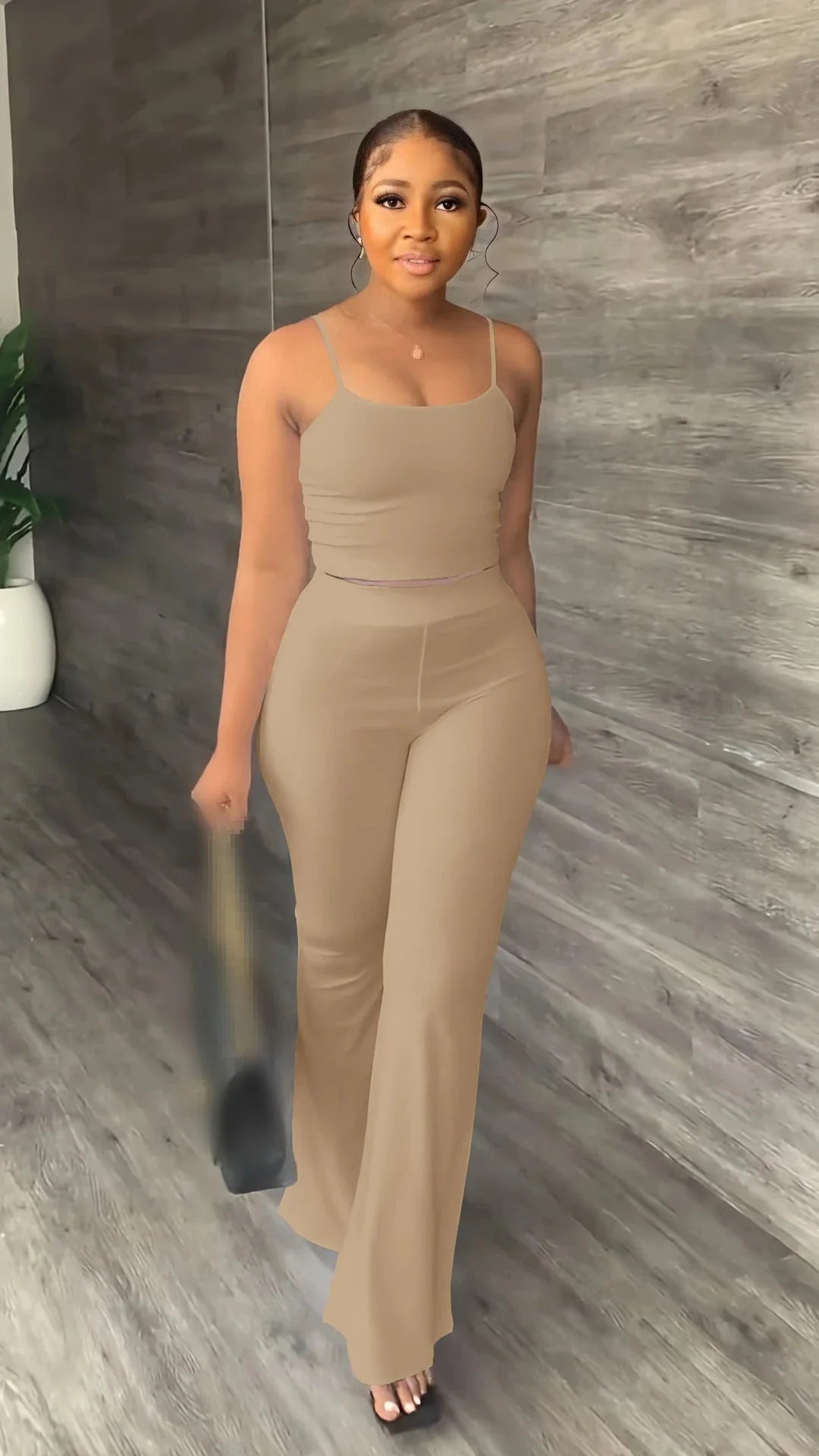 Stefion Women's 2 Piece Summer Set with sleeveless crop top and long pants, shown in a stylish, casual outfit.