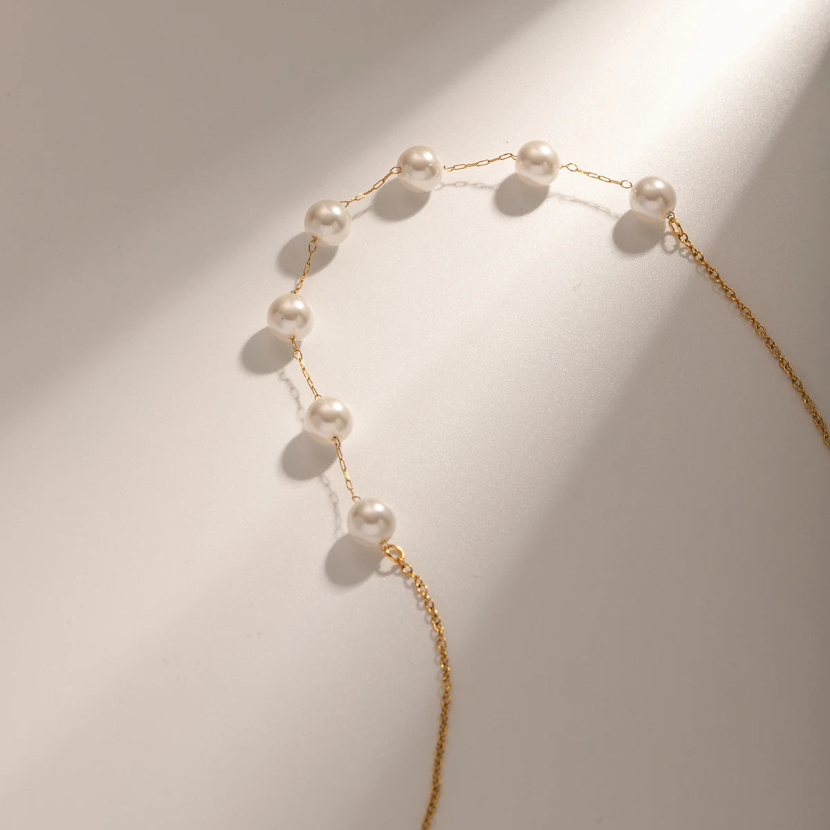 Elegant 18K gold plated stainless steel necklace with freshwater pearl and zircon accents, minimalistic luxury jewelry for women