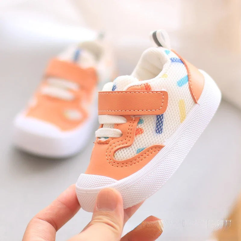 Unisex baby sneakers from SHOWLU FASHION STORE with breathable mesh upper and soft rubber sole, ideal for active little feet.