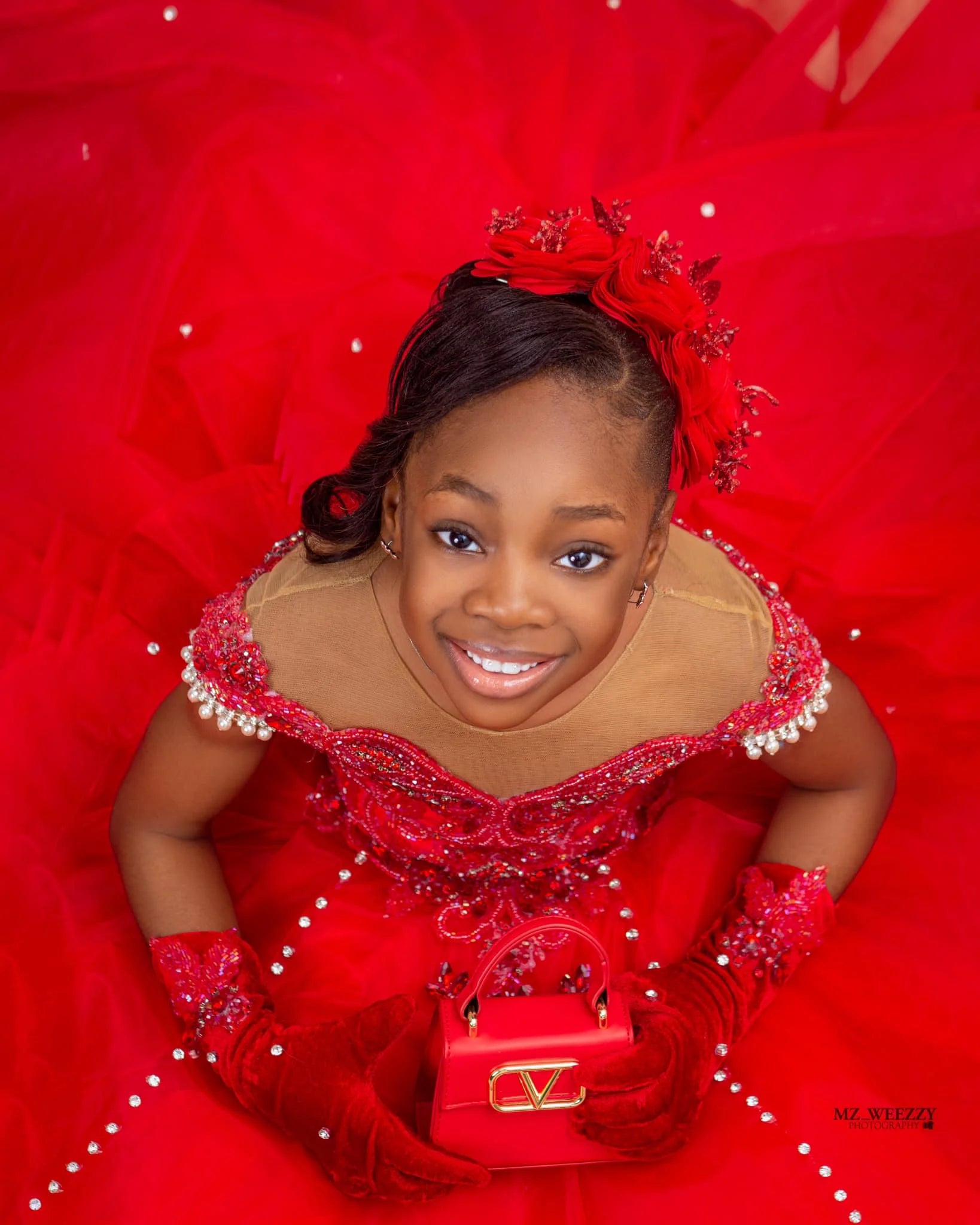 Red African flower girl princess birthday dress with intricate floral embroidery, designed for special occasions and celebrations.