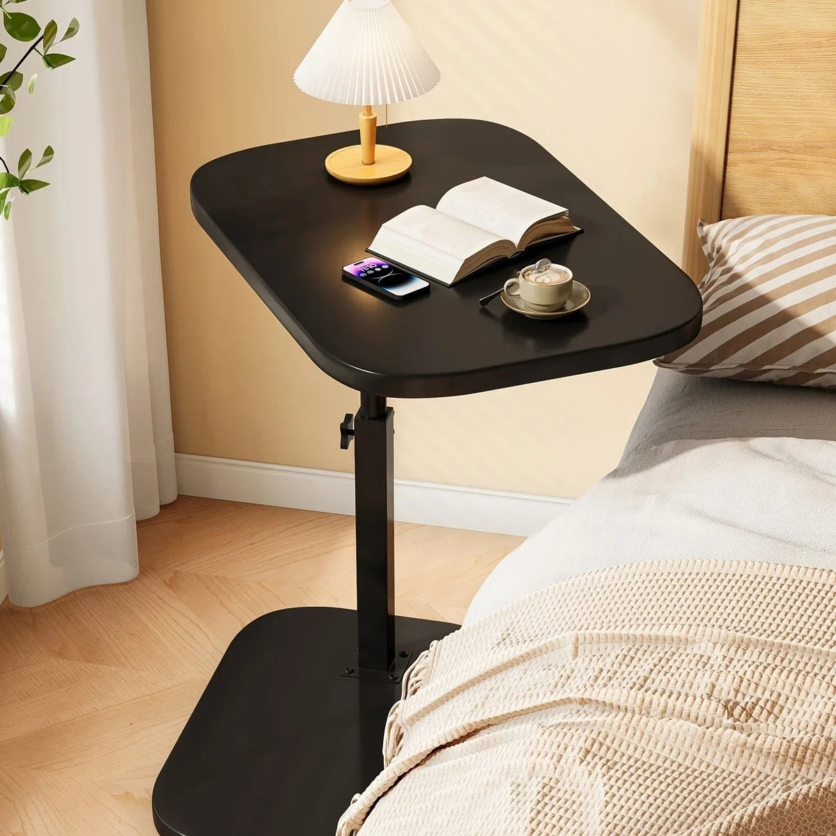 Portable adjustable folding side table for laptop or coffee use, featuring a sleek design suitable for home, office, or bedside.