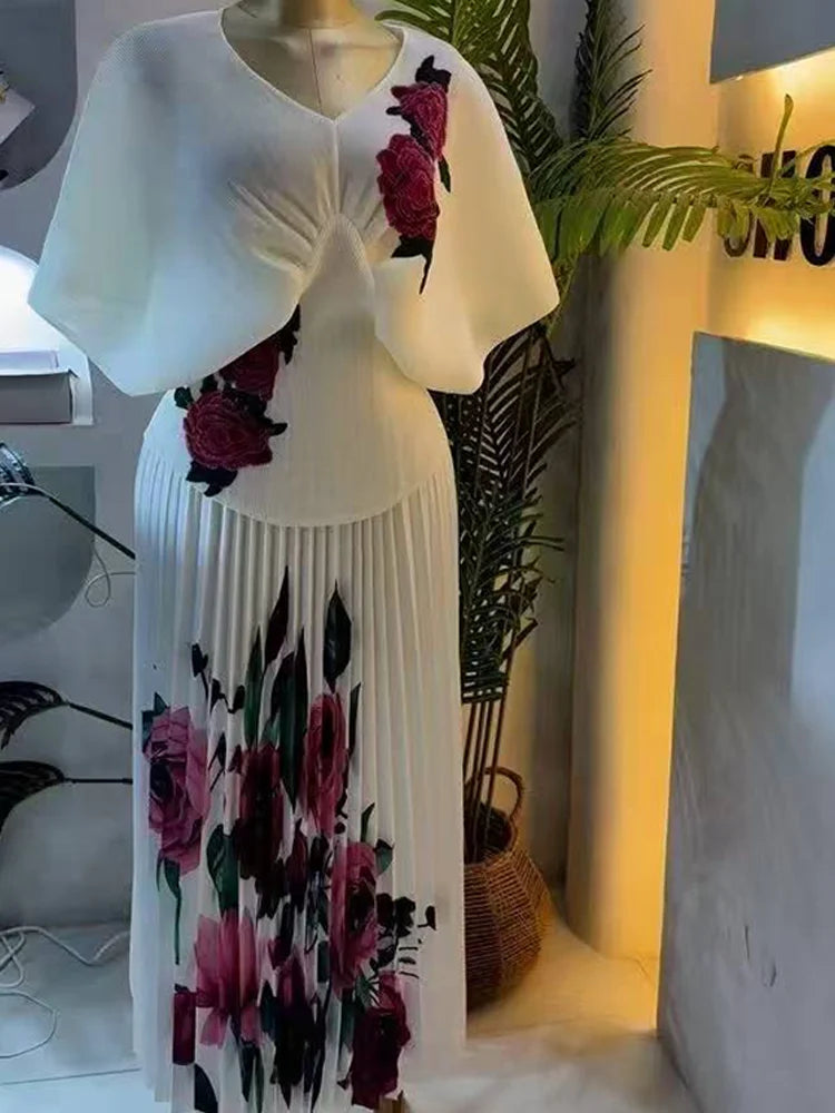 Showlu Fashion women's V-neck short sleeve pleated two-piece set with printed high waist slim skirt for elegant evening wear.