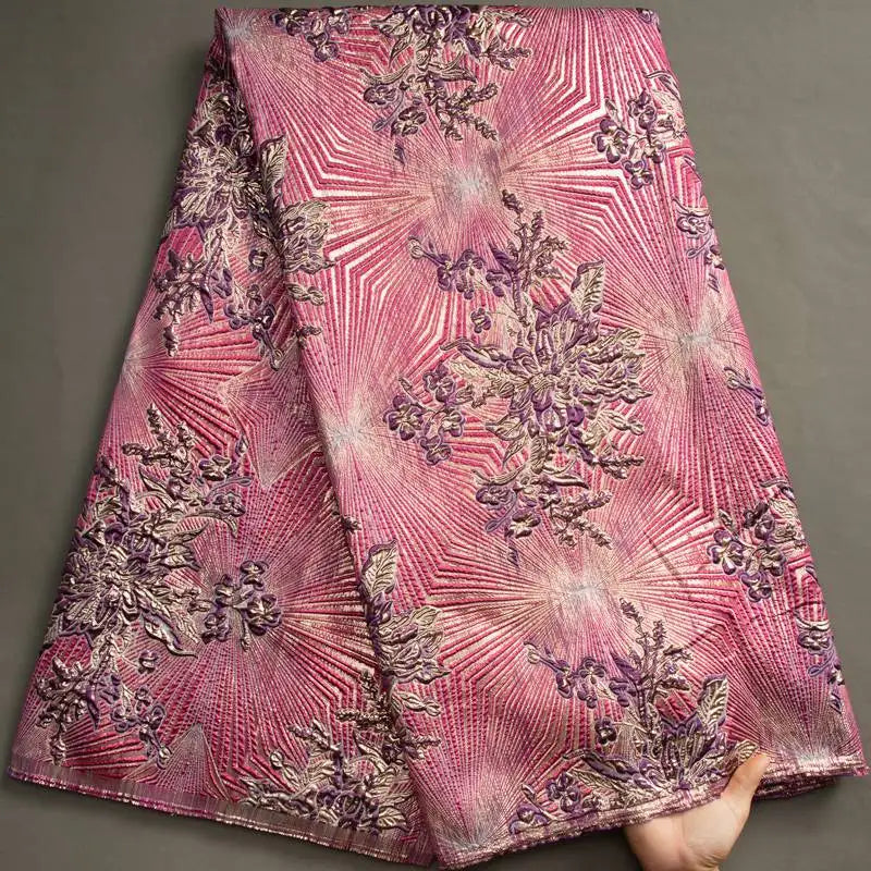 Nigerian Damask tulle fabric with floral brocade jacquard lace pattern, vibrant colorful design, perfect for elegant traditional attire.