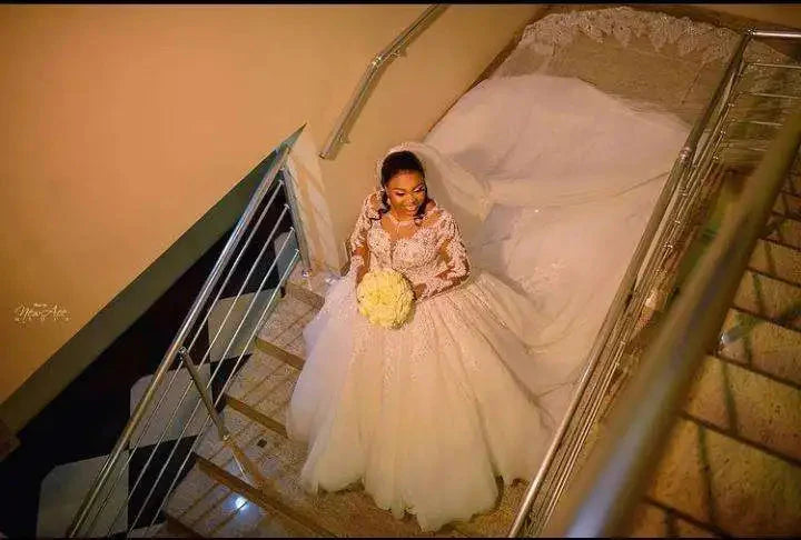 Beaded lace ball gown wedding dress with cathedral train by WEIAIJIAYI, featuring intricate details and elegant design.