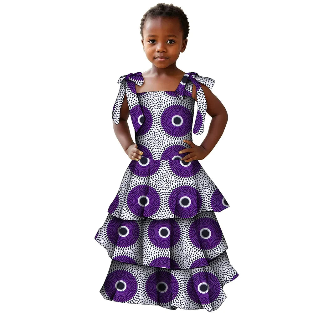 Colorful African print cotton girls' party dress featuring Bazin Riche style, perfect for special occasions and celebrations.