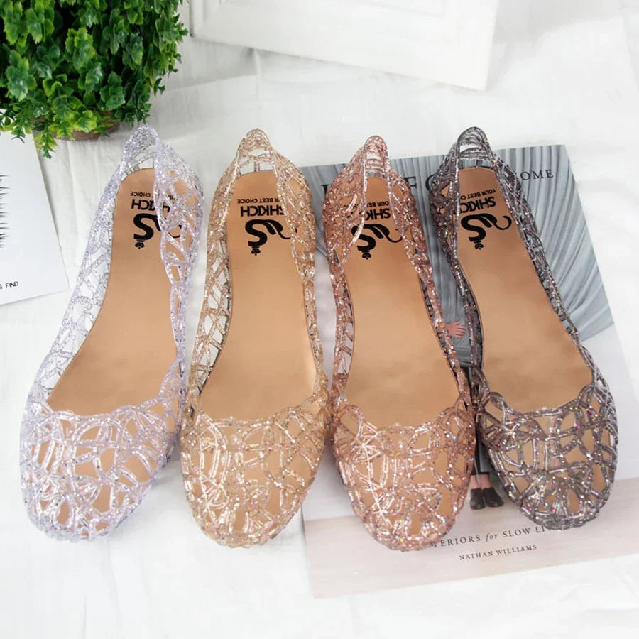 Showlu Fashion women's crystal jelly flat Roman beach sandals with clear straps and embellished details, perfect for summer wear.