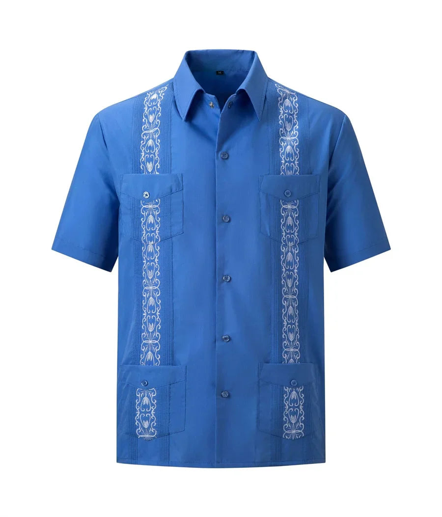 Men's white Guayabera shirt by Showlu Fashion with embroidered Cuban style, featuring traditional button details and lightweight fabric.
