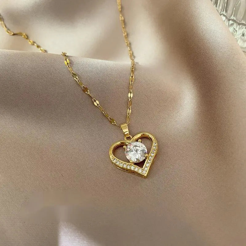 Heart-shaped pendant necklace in hollow zinc alloy, stylish party jewelry with elegant design by ZHIXUN, displayed on a jewelry stand.