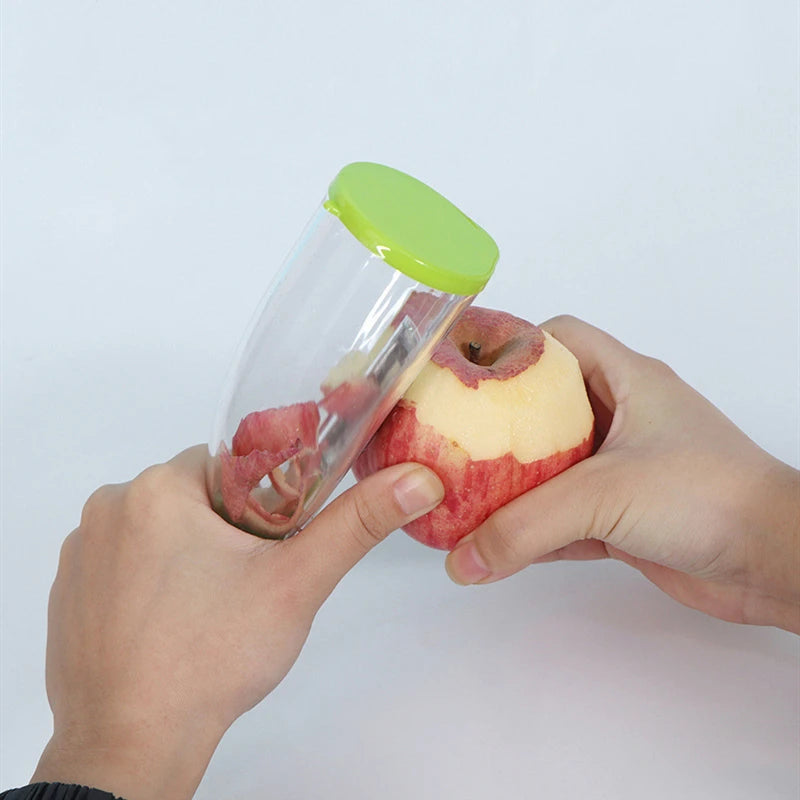 Showlu Fashion Store multifunctional peeling knife with storage tube, ideal for peeling apples and household kitchen tasks.
