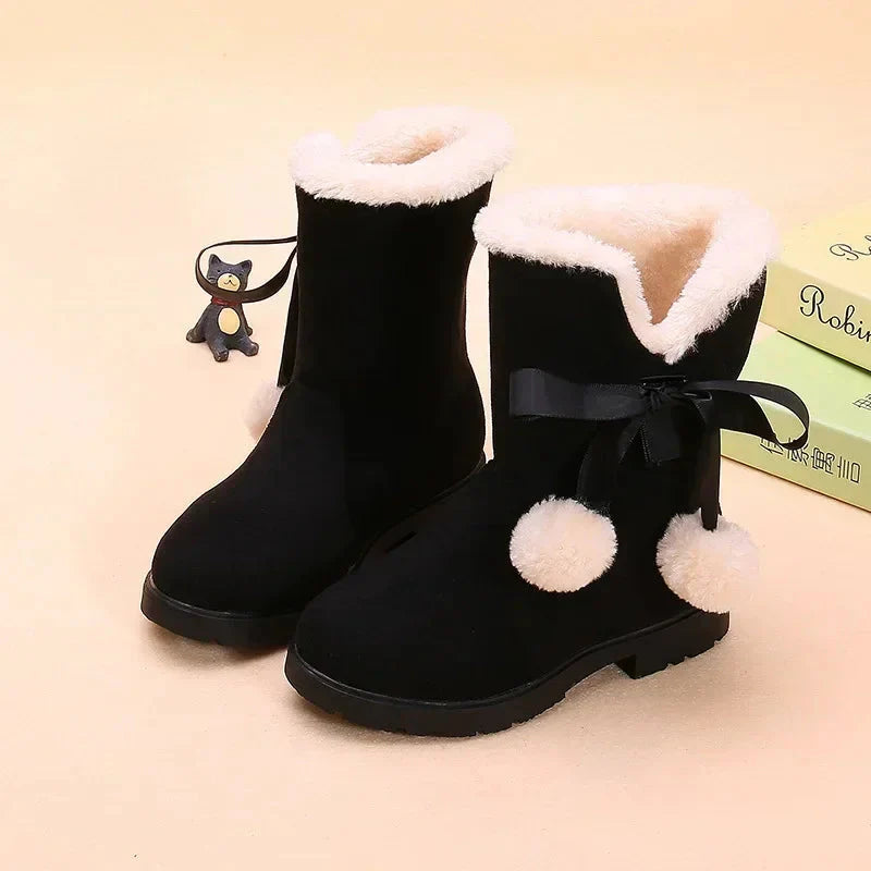 Girls winter snow boots by SHOWLU FASHION STORE featuring suede mid-calf design, fur lining, and bowtie embellishment.