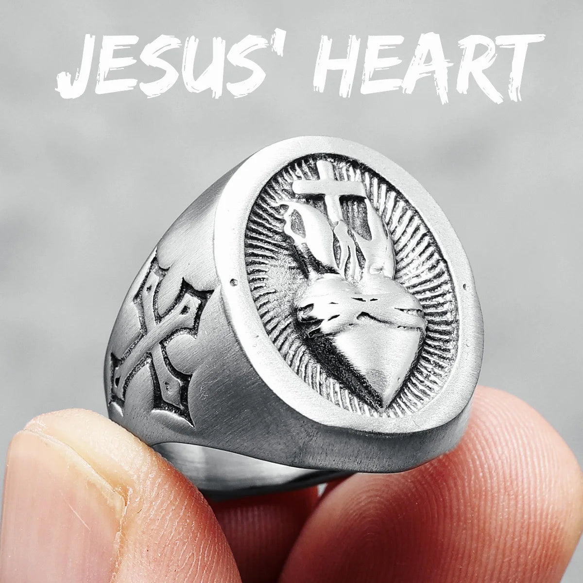 Stainless steel Heart of God cross ring with biker style amulet, featuring detailed metal design and a polished finish.