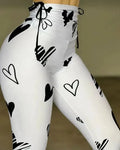 Owner Girl Heart Printed Yoga Leggings by SHOWLU FASHION STORE, showing pink heart pattern and slim fit design on stretchy sporty pants.