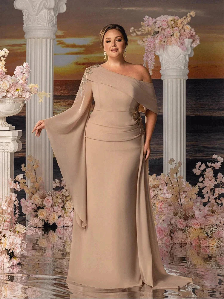 Apricot chiffon plus size strapless floor-length gown by Showlu Fashion with elegant flowing design and fitted bodice.