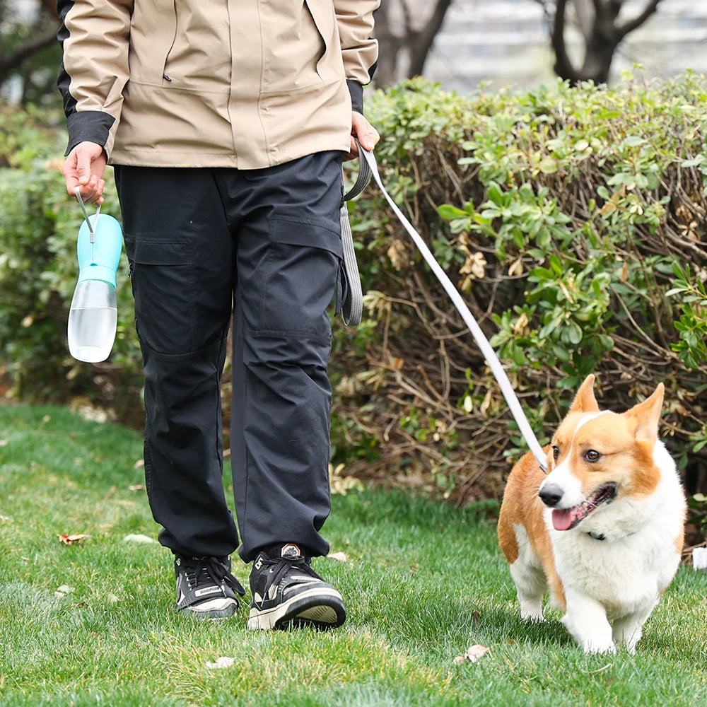 Showlu Smart General portable dog water bottle dispenser with leak-proof travel bowl for easy hydration on walks.