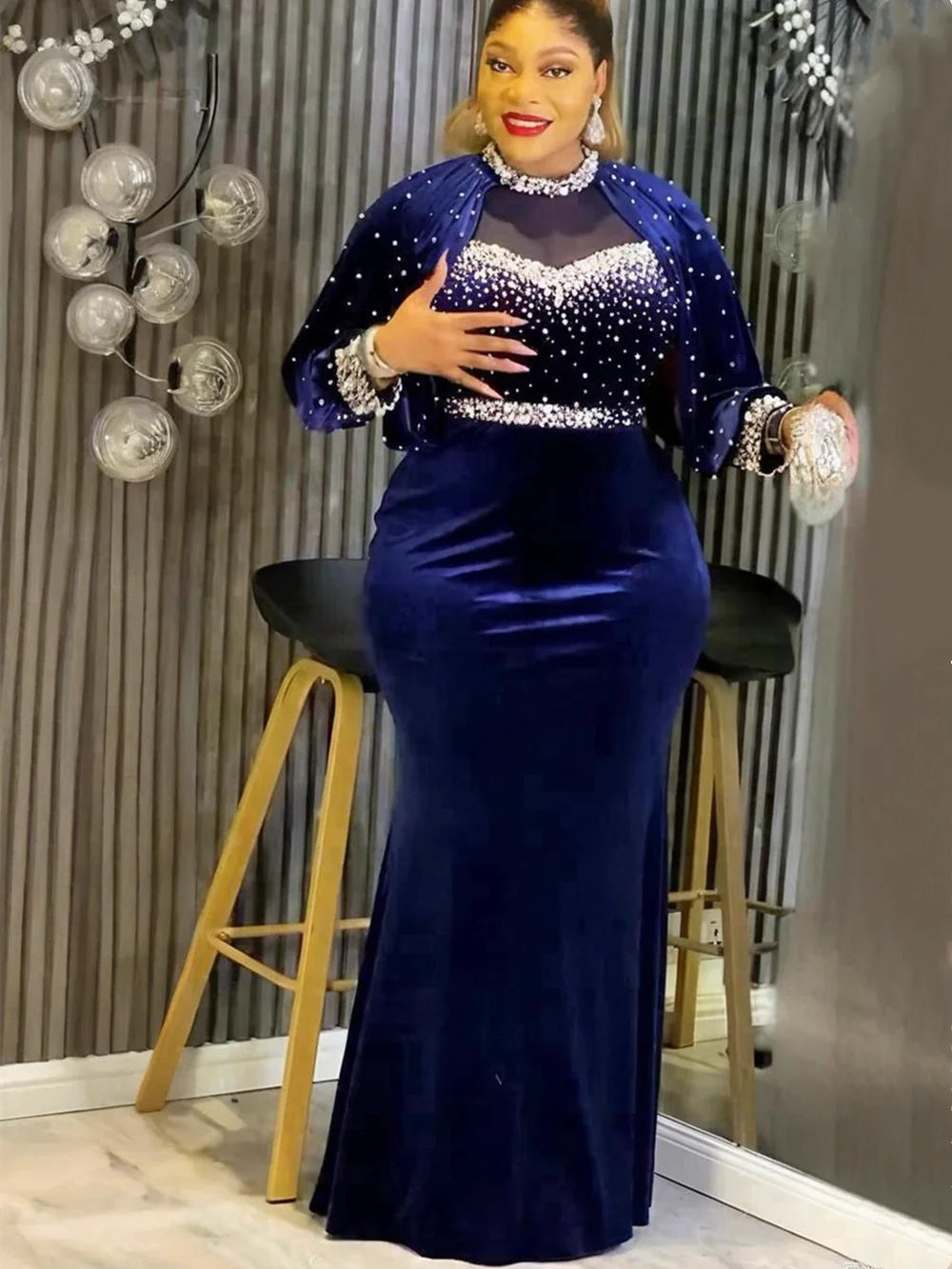 Plus size African party dress featuring Ankara velvet fabric and elegant maxi style, ideal for weddings and special occasions.
