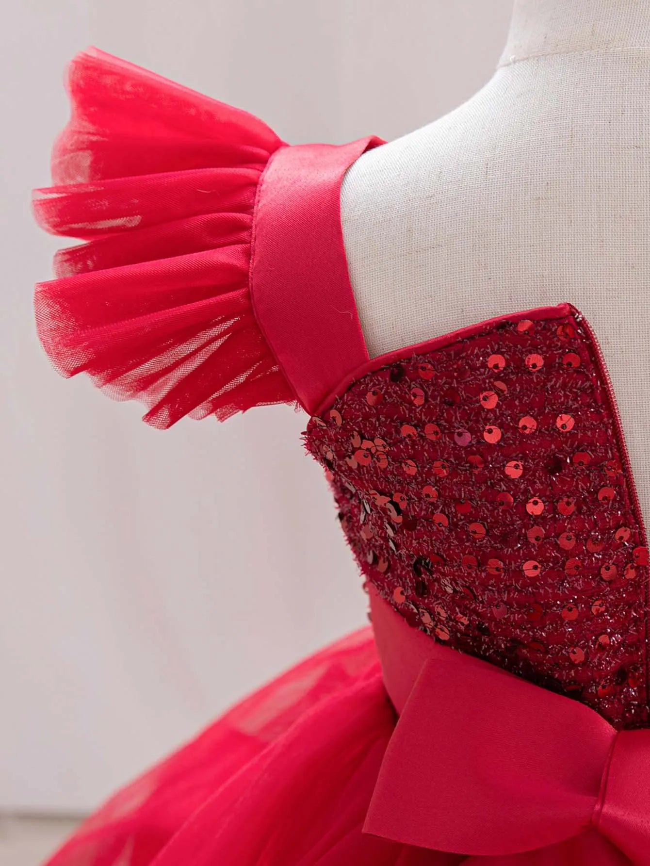 Red single-shoulder baby girl dress with sparkling flying sleeves, perfect for birthday parties and pageants for toddlers.