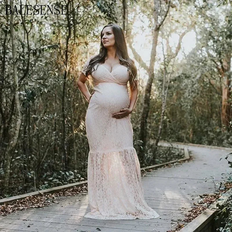 Showlu V-Neck lace maternity dress with short sleeves, flowing maxi gown designed for maternity photography and special occasions.