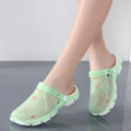 Showlu Women's casual jelly sandals in clear water shoes style, flat outdoor beach footwear with rubber soles and open-toe design.