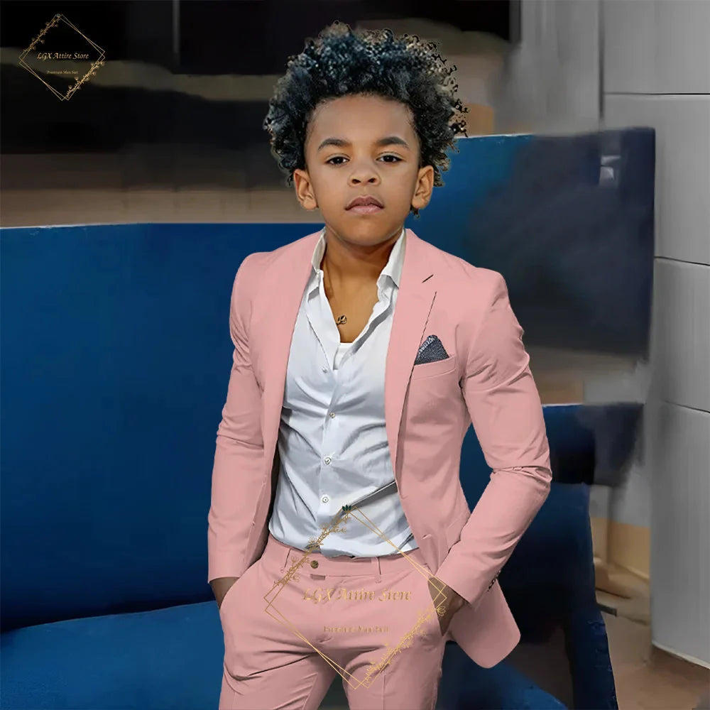 Boy wearing SHOWLU FASHION STORE orange slim fit 2-piece suit with single-breasted twill jacket and matching pants.