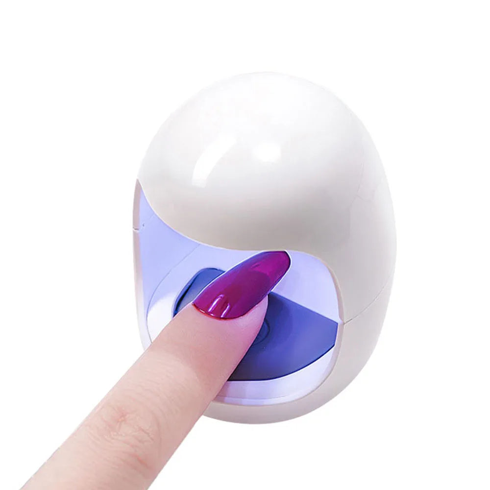 Showlu Smart General LED Nail Dryer Mini, compact device with multiple LED lights for quick, efficient nail drying.