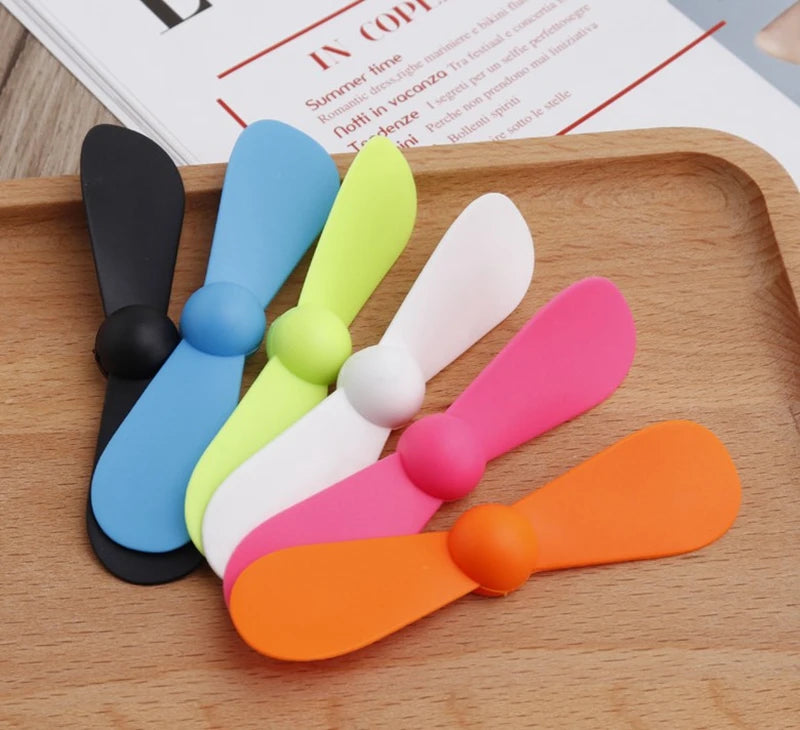 Showlu Smart General USB mini fan with compact design and adjustable blades, ideal for portable cooling on the go.