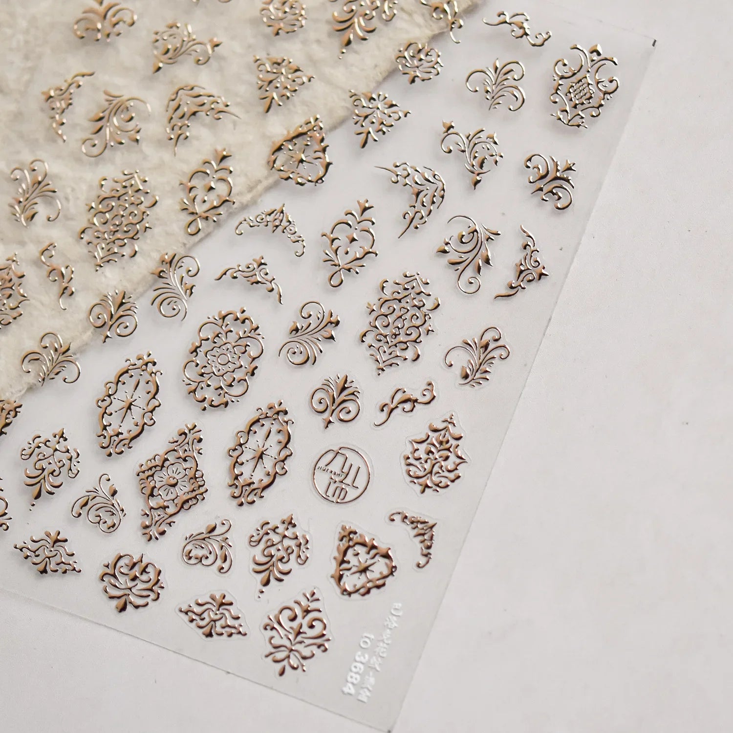 Elegant gold scepter-themed 5D nail art stickers with gemstone accents, perfect for luxurious manicure decor.