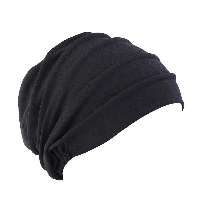 Women’s solid color turban cancer beanie by Showlu Fashion, elastic hijab cap for hair loss, chemo, or everyday head covering.