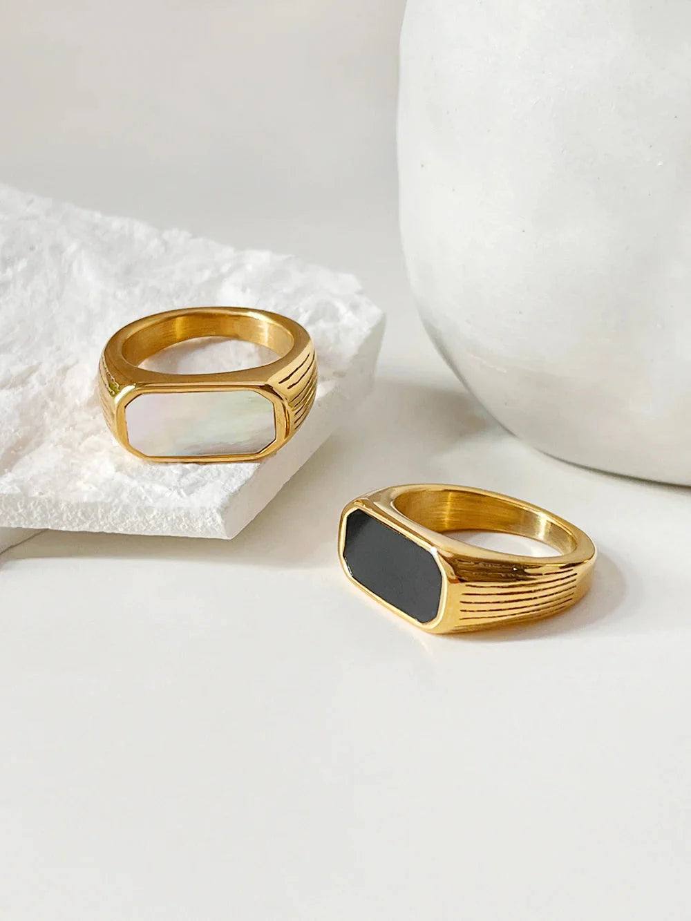 Gold plated stainless steel Peri'sBox Mother of Pearl rectangle ring with elegant design, showcasing a sleek and stylish jewelry piece