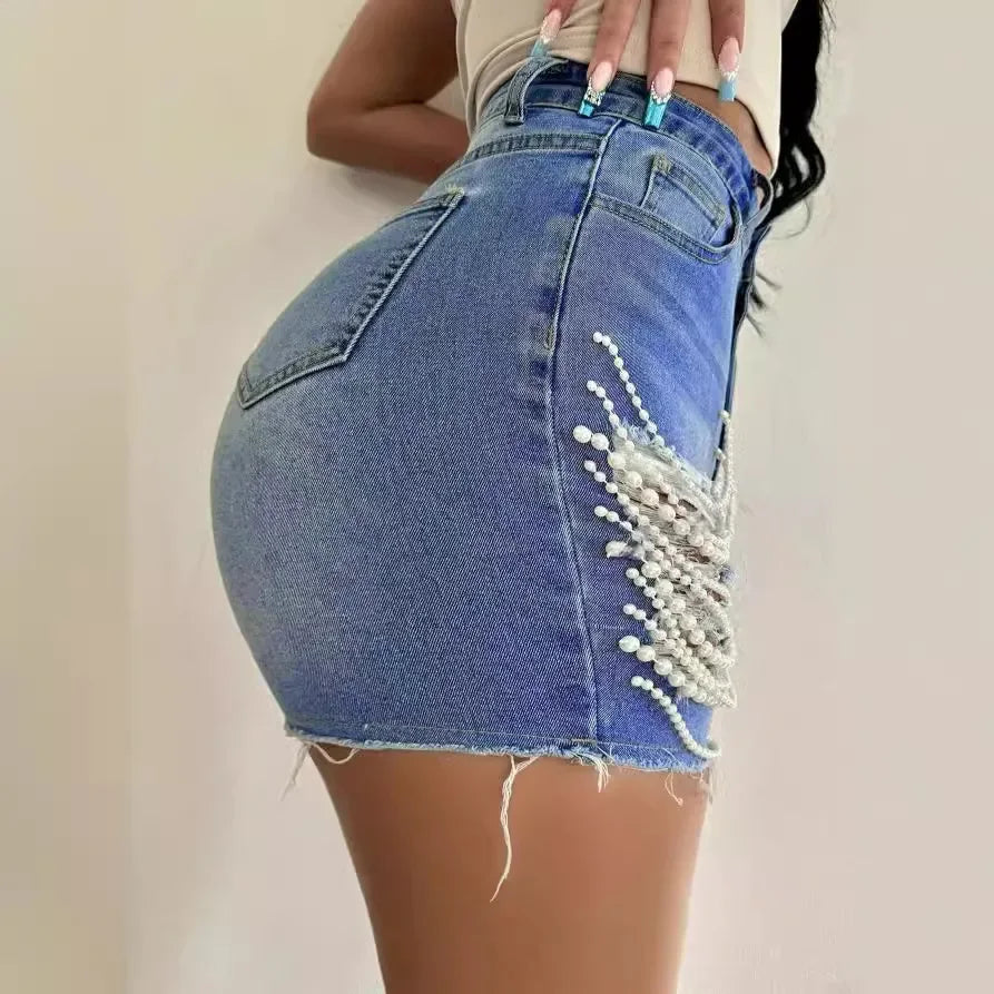 SHOWLU FASHION STORE women's high waist ripped denim shorts with pearl chain detail, showcasing stylish shorts with distressed accents.