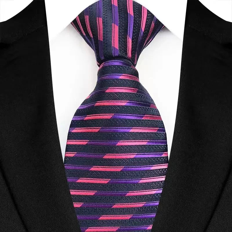 Purple men's necktie featuring floral plaid jacquard weave with stripe patterns, suitable for business, wedding, or formal events.