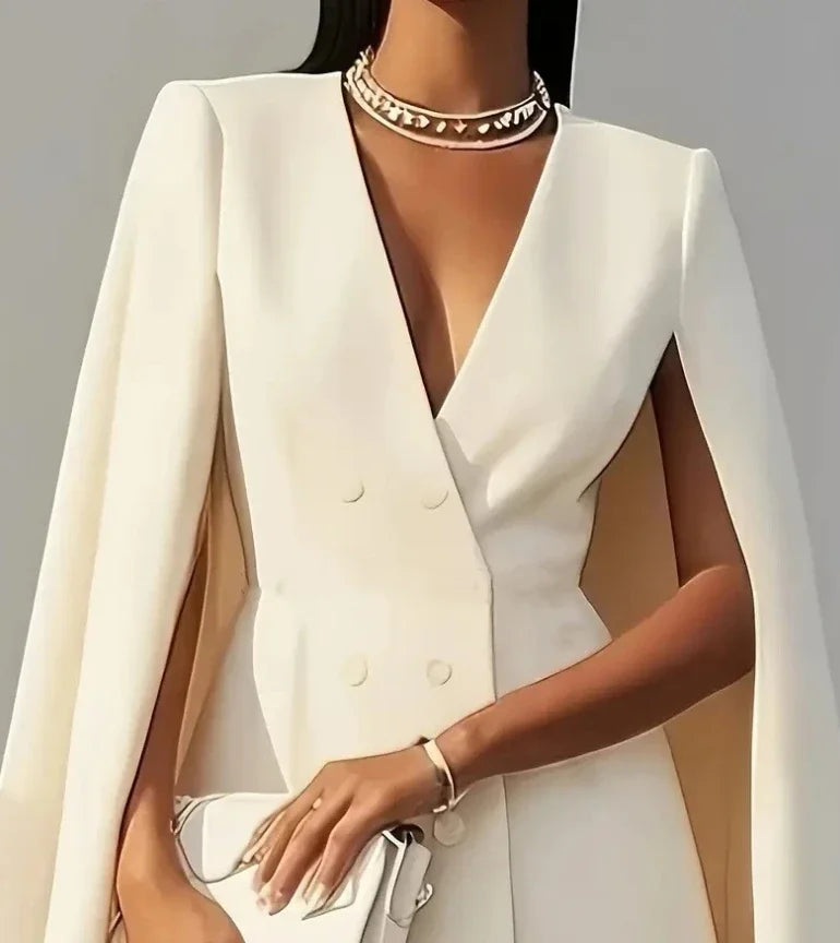 Women's V-neck double-breasted shawl cape mini dress by Showlu Fashion in solid color, featuring a stylish and elegant design.