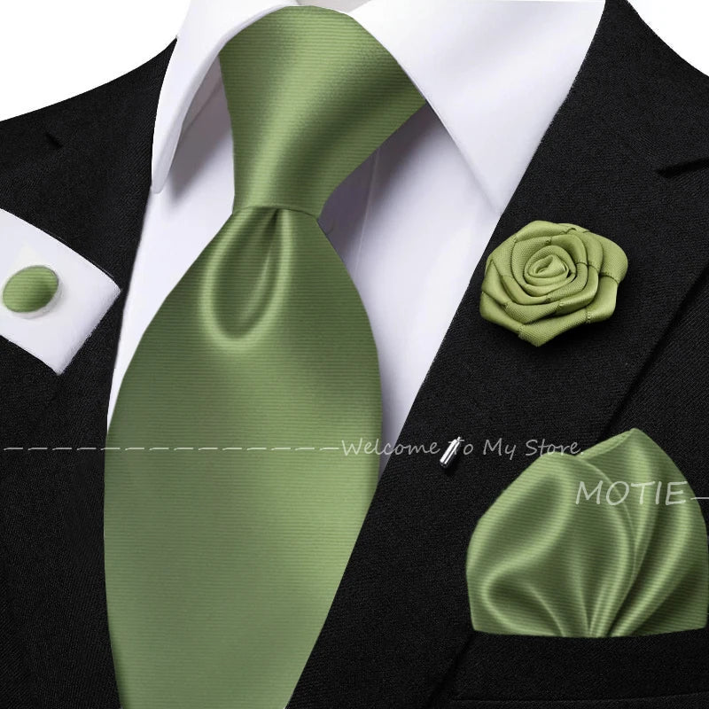 Men's solid color tie set with sage green pocket square, flower, brooch, and cufflinks for wedding or daily wear.