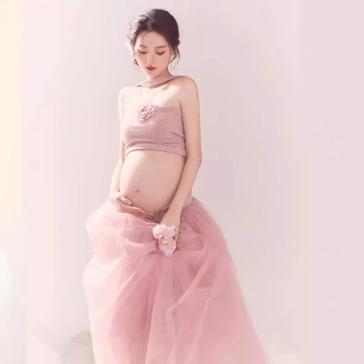 Pink tube top and mesh tutu skirt maternity photography outfit by Showlu Fashion Store, styled for maternity photoshoots.