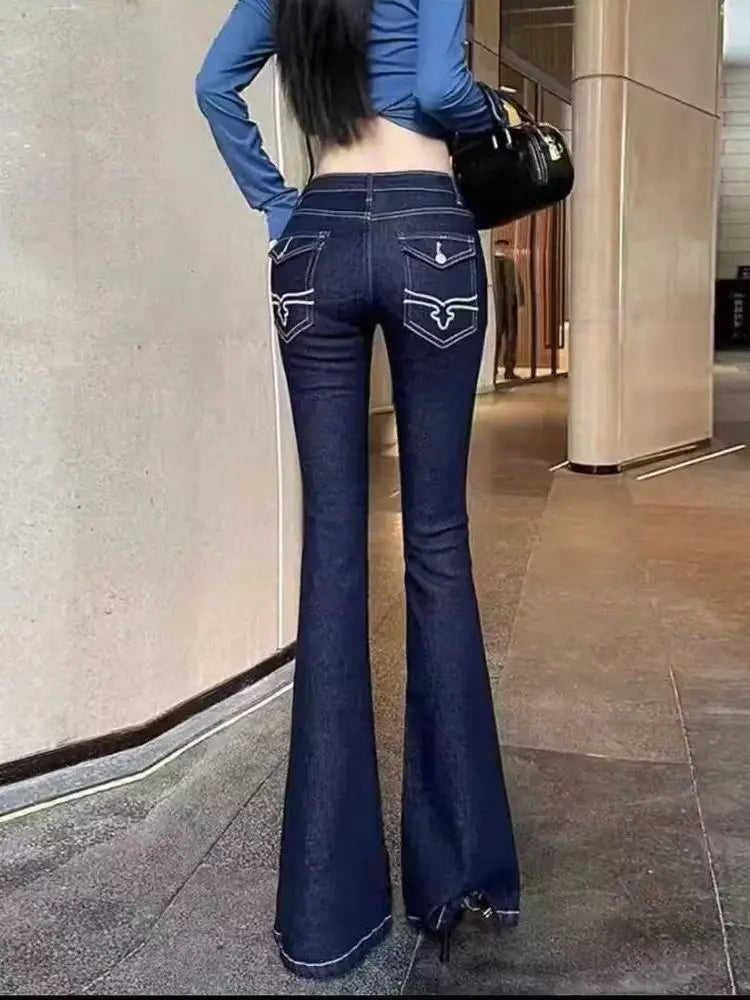 Women’s vintage blue flare jeans with embroidery, high waist denim cargo pants, Y2K streetwear style, bell bottom trousers.
