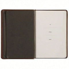 An open brown prayer diary with a blank dedication page featuring lines for to, from, and date.