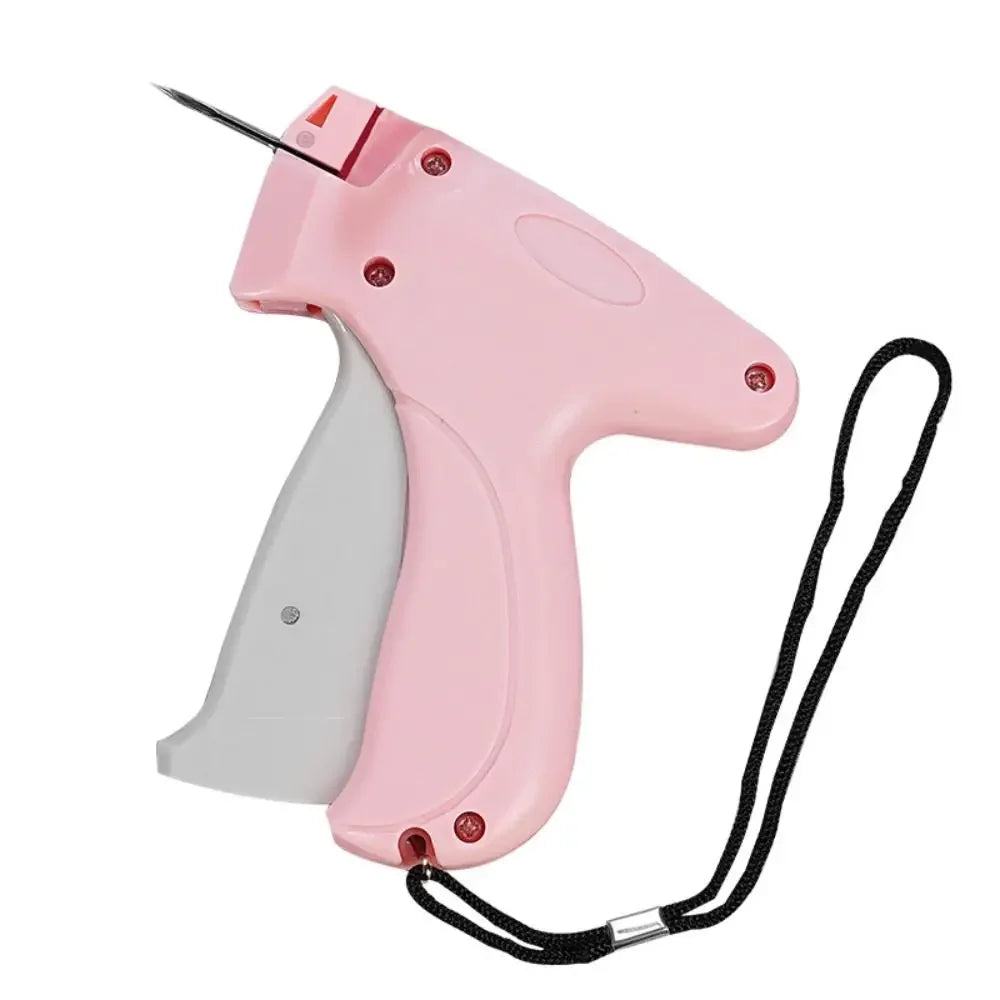 SHOWLU Portable Quick Clothing Fixer and Micro Stitch Tag Gun for clothes, shown with needle and compact design for easy repairs