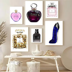 A gallery wall set featuring five modern prints of perfume bottles and a high-heeled shoe.