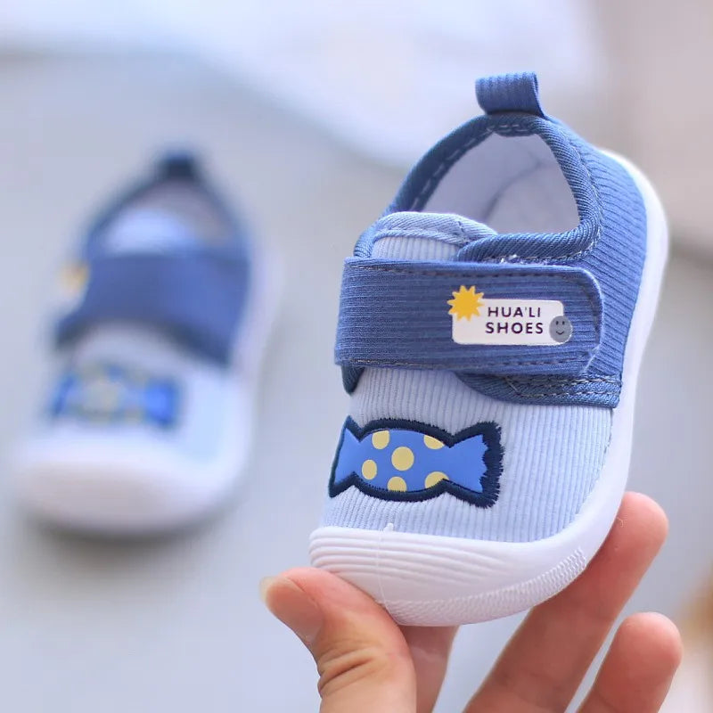 Showlu Fashion Baby Cartoon Squeaky Shoes on non-slip canvas first walkers with playful design and soft sole for toddlers' first steps.