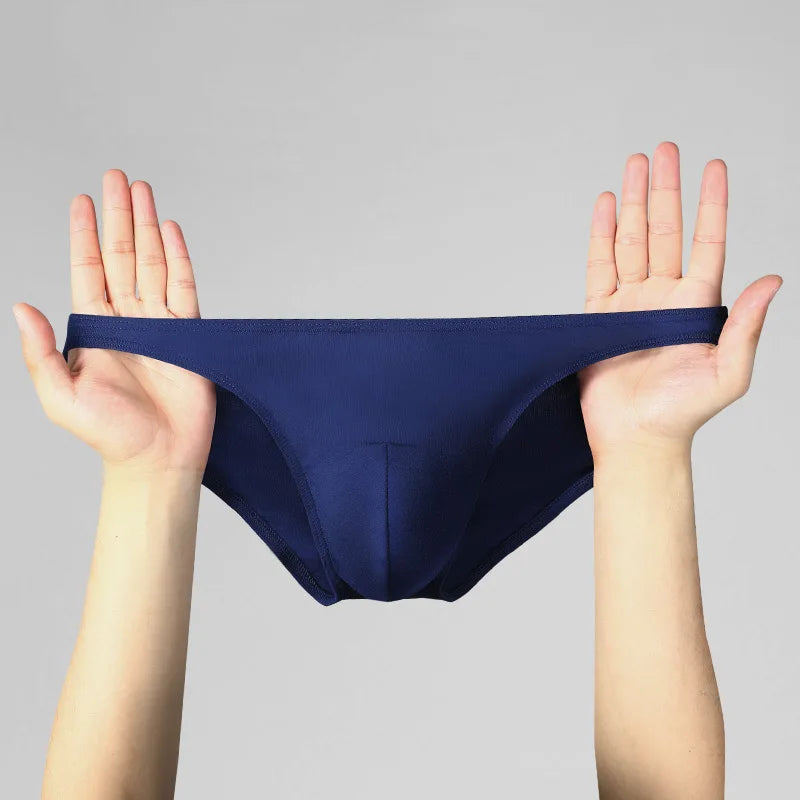 Showlu men's modal briefs with low waist design, U-convex stretch underwear in black fabric, close-up view of waistband and fit