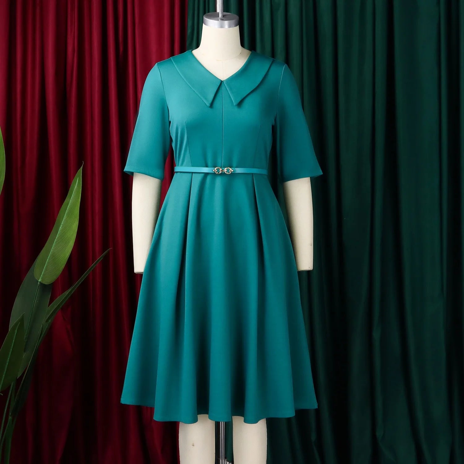 Elegant office dress for women featuring a V-neck, half sleeves, belt, and pleated mid-calf length, perfect for professional work.